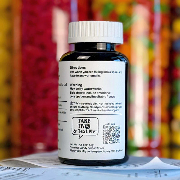 A crisp close-up of the Take Two & Text Me 'Cry Later Capsules' parody prescription label text with humorous directions and side effects.