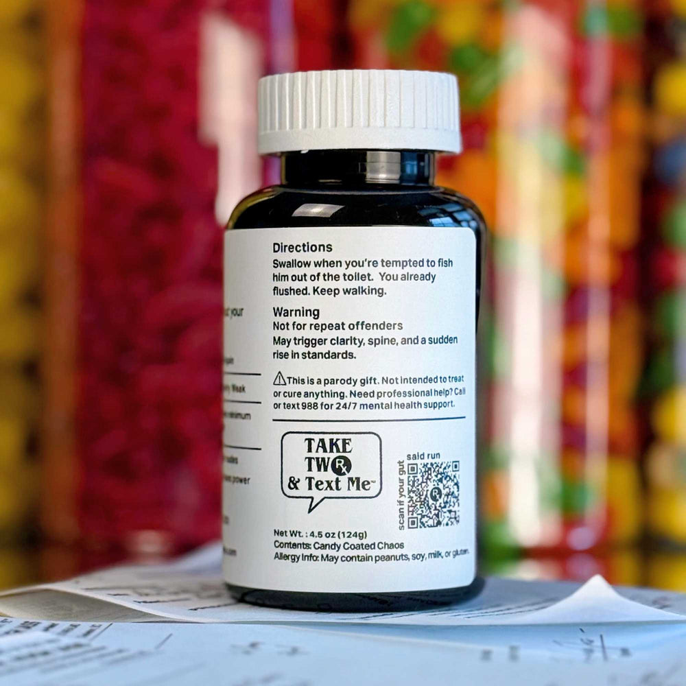 A dark amber parody prescription bottle labeled 'F*ckboi Flush' by Take Two & Text Me, a funny novelty breakup gift for a friend.