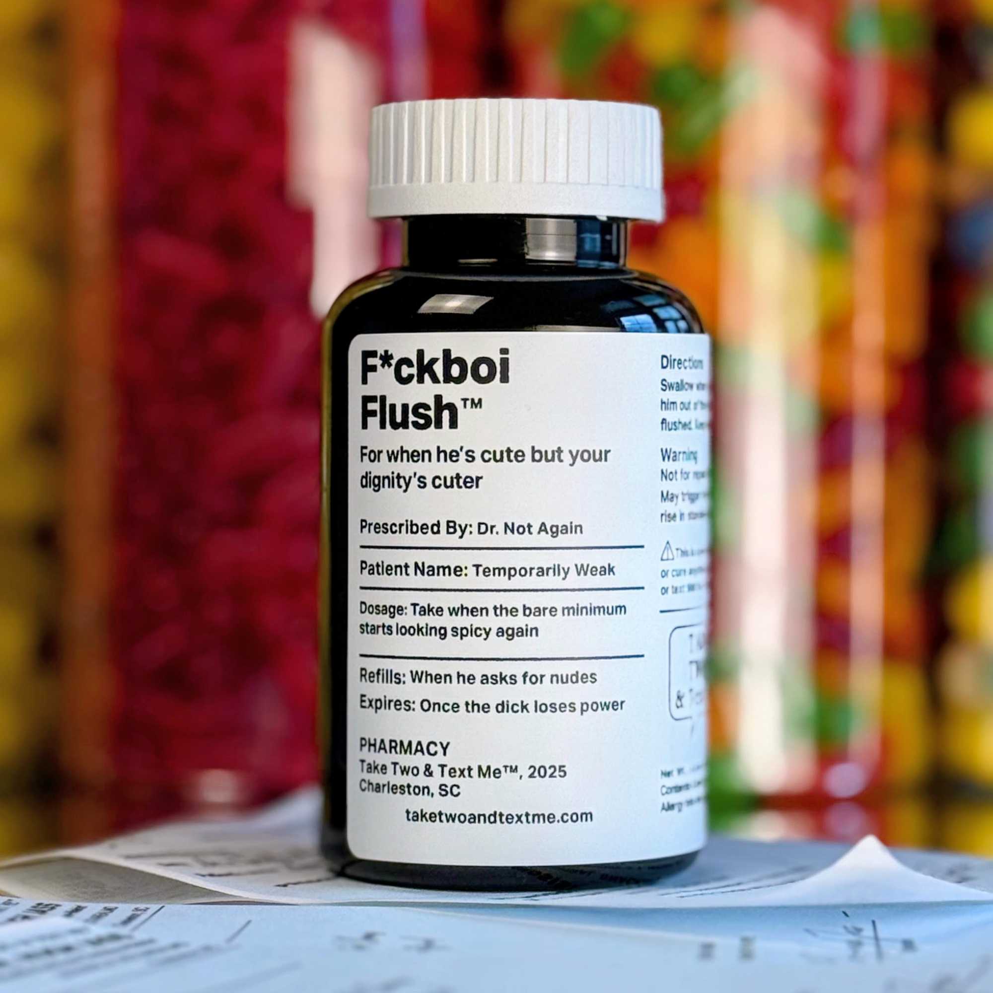 A dark amber parody prescription bottle labeled 'F*ckboi Flush' by Take Two & Text Me, a funny novelty breakup gift for a friend.