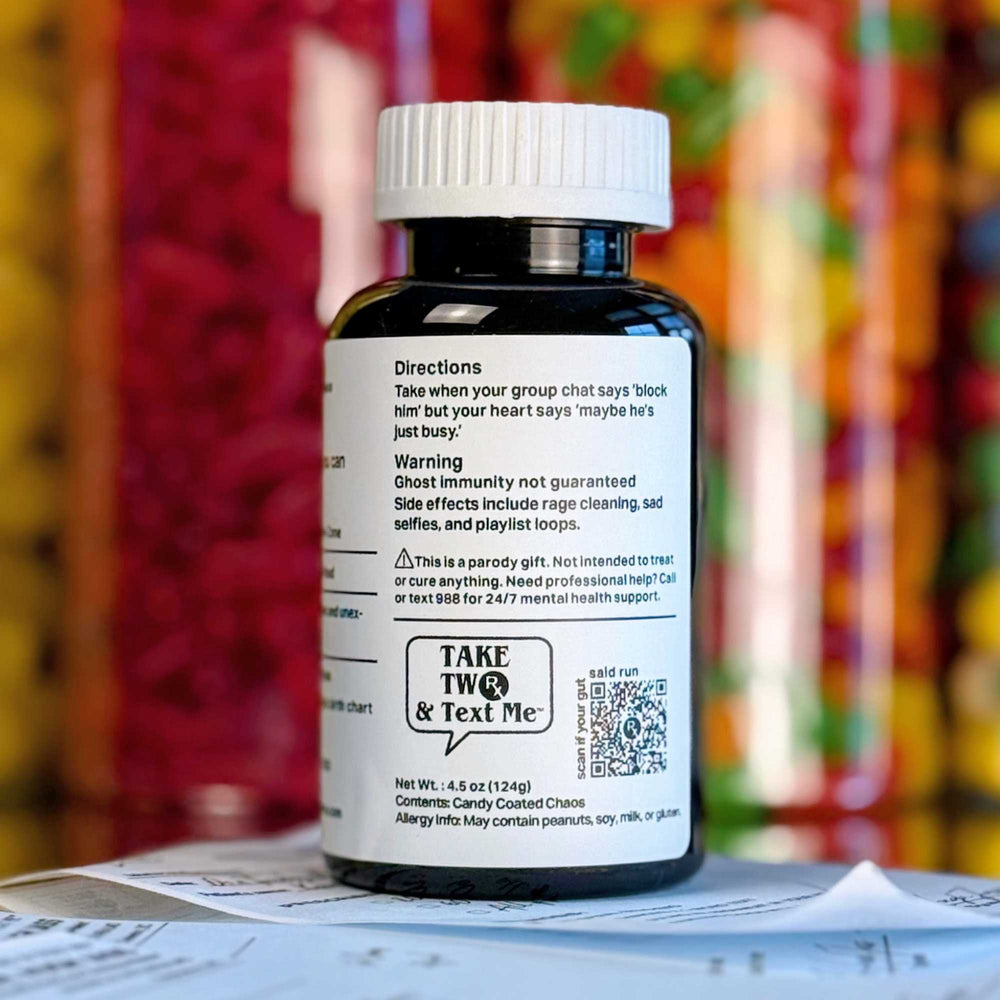 Detailed close-up of the 'Ghosted... Again' parody prescription bottle label by Take Two & Text Me, listing comical symptoms and treatment protocols.